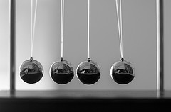 image of four pendulums in a row  Creative Commons Attribution 2.5 License by Peter Shanks